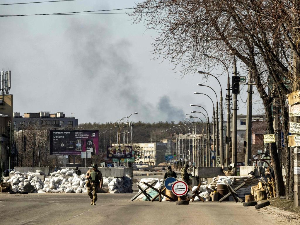 Ukrainian servicemen stand at a check point in Kyiv. Picture: AFP