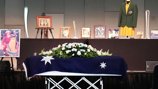 The coffin surrounded by memorabilia. Picture Glenn Hampson