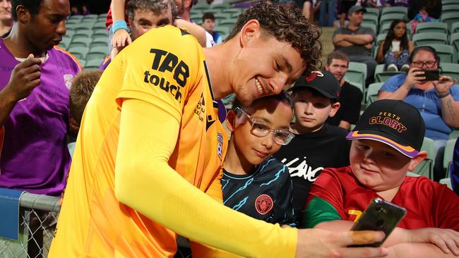 Cameron Cook of the Glory takes a selfie with the fans after a win against Brisbane Roar on February 17, 2024, in Perth, Australia. Picture: James Worsfold