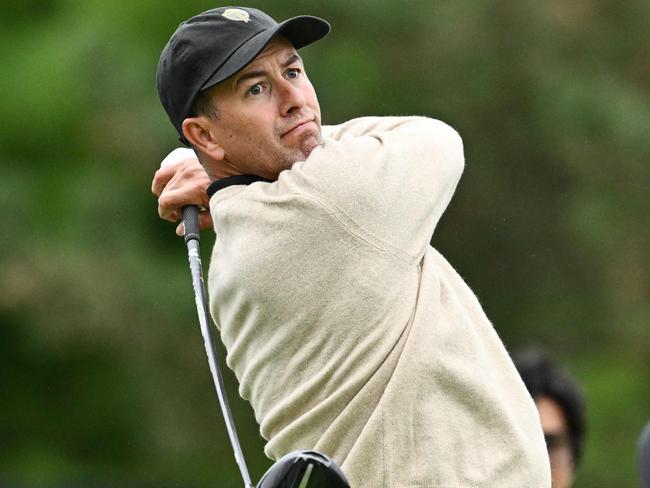 MONTREAL, QUEBEC - SEPTEMBER 24: Adam Scott of Australia and the International Team plays a shot as Corey Conners of Canada and the International Team looks on during a practice round prior to the 2024 Presidents Cup at The Royal Montreal Golf Club on September 24, 2024 in Montreal, Quebec, Canada.   Minas Panagiotakis/Getty Images/AFP (Photo by Minas Panagiotakis / GETTY IMAGES NORTH AMERICA / Getty Images via AFP)