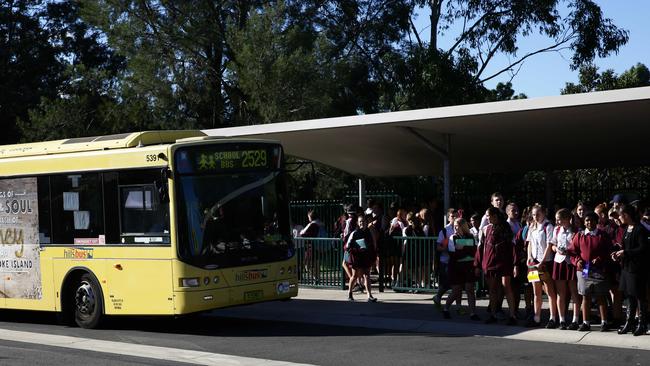 Crowded buses outside Northmead High School wher some children have been left behind after school.