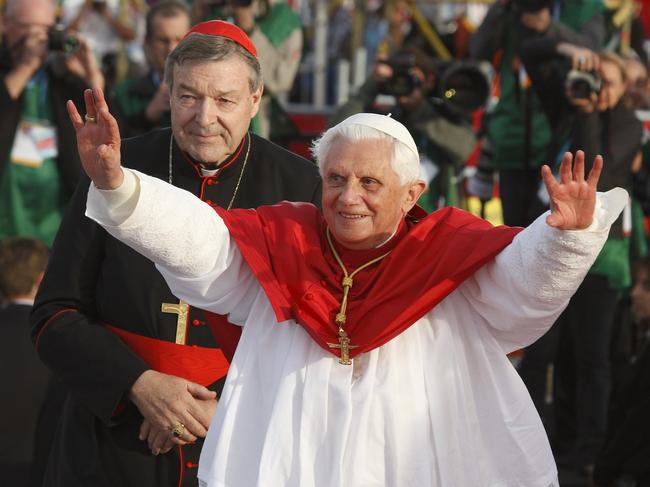 Happy memories: Pell looks on as Pope Benedict XVI greets World Youth Day pilgrims in Sydney in 2008. Picture: CNS