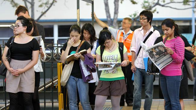 Generic photo of crowd of people waiting for their train on platform at Central Railway Station in Sydney, NSW, to accompany story on immigration and population growth.