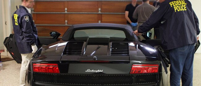 AFP officers confiscated multiple luxury cars — including this Lamborghini — during Operation Beaufighter. Picture: AFP