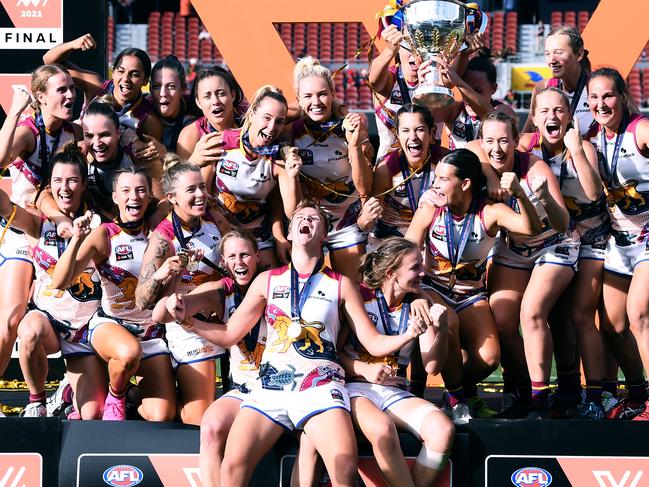 The Lions’ premiership winning team celebrate their win on Adelaide Oval. Picture: MARK BRAKE/GETTY IMAGES