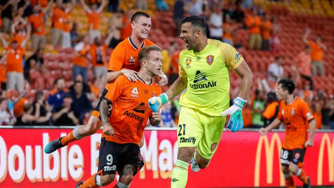 Adam Taggart is congratulated after scoring an injury-time equaliser. Picture: AAP.