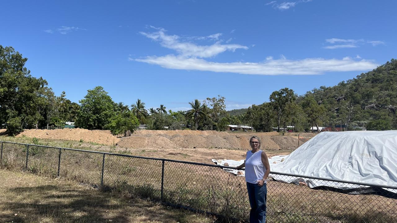 Nelly Bay resident Angela Hallett is concerned that the property behind her, 55-77 Kelly St, is being used for industrial purposes which contradicted what the community wanted.