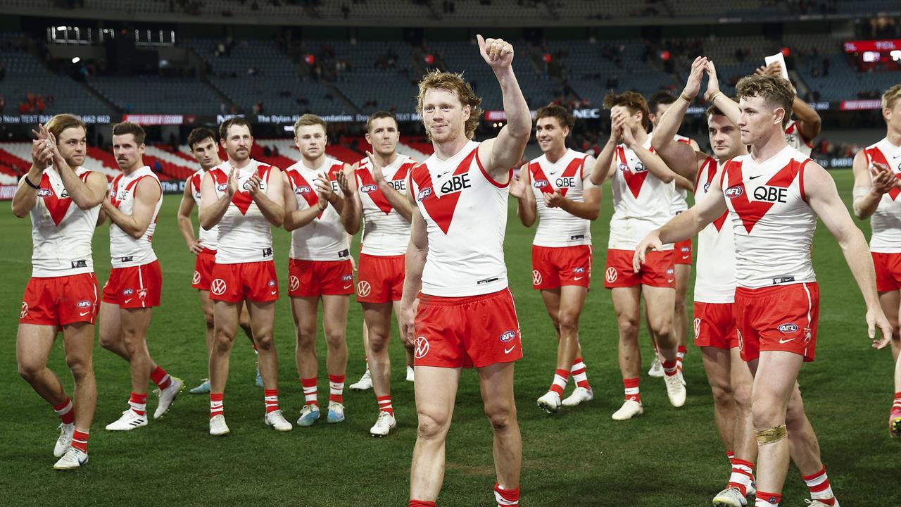 Callum Mills leads the Swans from the ground after the victory over Essendon at Marvel Stadium, on July 29, 2023, in Melbourne, Australia. (Photo by Daniel Pockett/Getty Images)