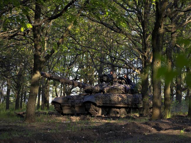 Ukrainian servicemen of the Adam tactical group ride a T-64 tank from a front line near the town of Bakhmut, Donetsk region, on May 7, 2023. Picture: Sergey SHESTAK / AFP