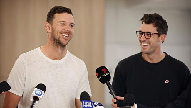 Josh Hazlewood and Cummins share a joke at Sydney Airport. Whatever their “values”, there’s a good vibe in this Australian team. Photo: Adam Yip