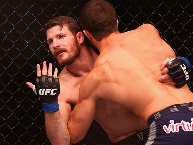 SYDNEY, AUSTRALIA - NOVEMBER 08: Michael Bisping appeals to the referee after being cut above the eye by Luke Rockhold in their middleweight fight during the UFC Fight Night 55 event at Allphones Arena on November 8, 2014 in Sydney, Australia. (Photo by Mark Kolbe/Getty Images)