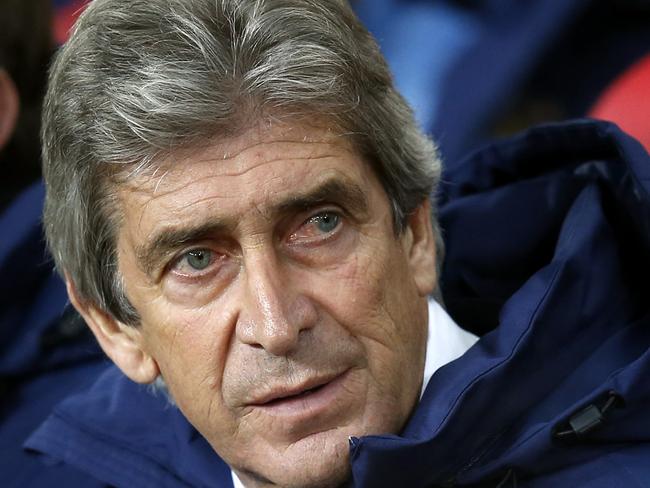 Manchester City's manager Manuel Pellegrini awaits the start of the match ahead of their English Premier League soccer game against Sunderland at the Stadium of Light, Sunderland, England, Wednesday, Dec. 3, 2014. (AP Photo/Scott Heppell)