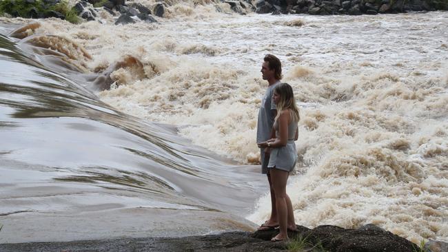 Floodwaters pouring over Oxenford weir in Queensland. Picture: Glenn Hampson