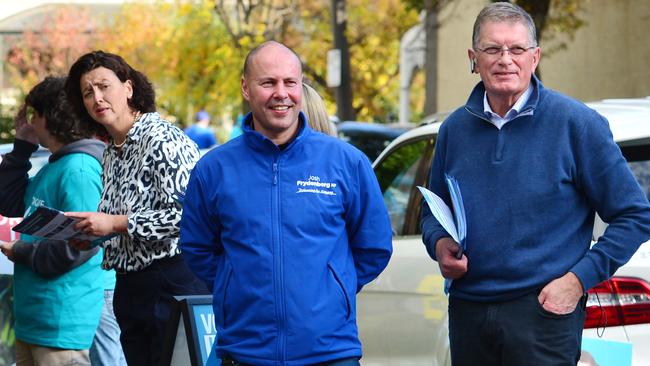 Federal Treasurer Josh Frydenberg (centre) is in the fight of his life against teal independent Monique Ryan. Photo: Nicki Connolly