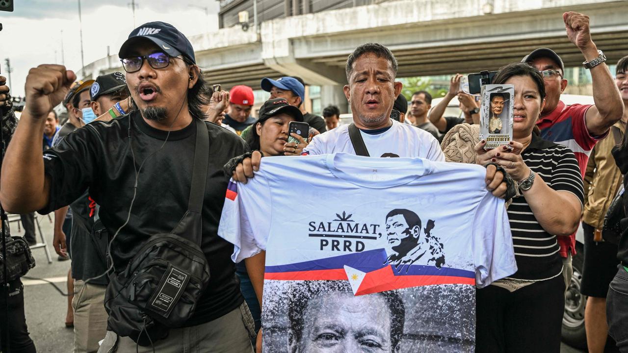 Mr Duterte was highly controversial, but still also has a strong base of support in the Philippines, as seen by supporters shouting slogans as they gather outside the Villamor Air Base in Pasay, Metro Manila on March 11, 2025. (Photo by Jam STA ROSA / AFP)