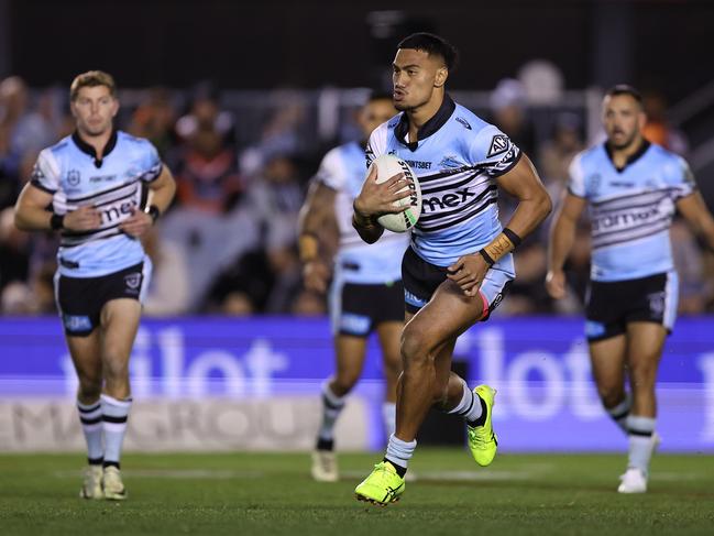 SYDNEY, AUSTRALIA - JULY 12:  Ronaldo Mulitalo of the Sharks runs the ball during the round 19 NRL match between Cronulla Sharks and Wests Tigers at PointsBet Stadium on July 12, 2024, in Sydney, Australia. (Photo by Brendon Thorne/Getty Images)