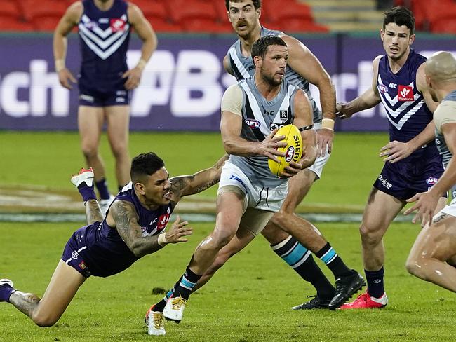 Travis Boak of the Power during the Round 3 AFL match between the Fremantle Dockers and the Port Adelaide Power at Metricon Stadium on the Gold Coast, Sunday, June 21, 2020. (AAP Image/Dave Hunt) NO ARCHIVING, EDITORIAL USE ONLY