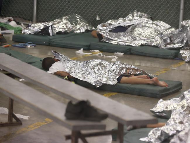 Young boys sleep in a holding cell. Picture: AP Photo/Ross D. Franklin