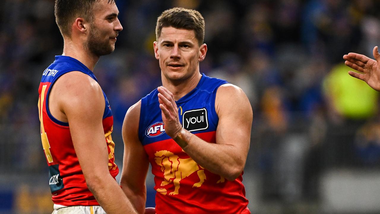 PERTH, AUSTRALIA - JULY 14: Dayne Zorko of the Lions celebrates the win at the siren during the 2024 AFL Round 18 match between the West Coast Eagles and the Brisbane Lions at Optus Stadium on July 14, 2024 in Perth, Australia. (Photo by Daniel Carson/AFL Photos via Getty Images)