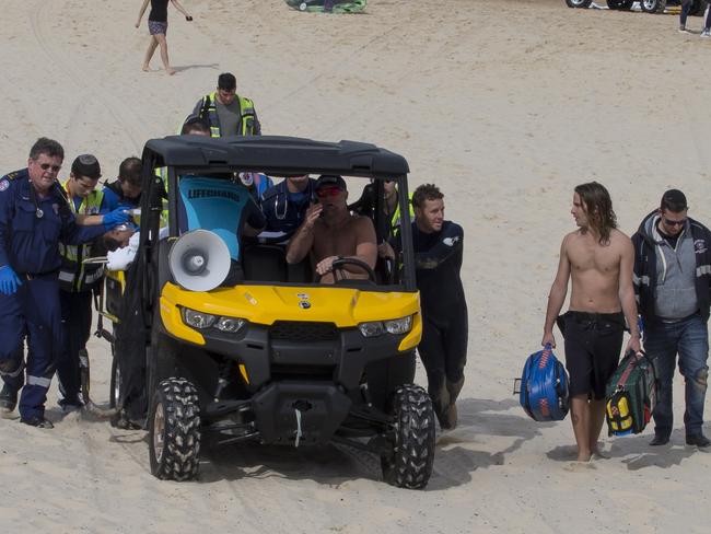 Both teens were taken by beach buggies to the ambulance. Picture: Splash