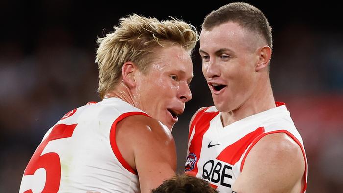 MELBOURNE, AUSTRALIA - MARCH 15: Chad Warner of the Swans celebrates a goal with teammate Isaac Heeney during the 2024 AFL Round 01 match between the Collingwood Magpies and the Sydney Swans at the Melbourne Cricket Ground on March 15, 2024 in Melbourne, Australia. (Photo by Dylan Burns/AFL Photos via Getty Images)