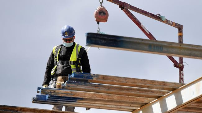 A construction worker wears a face masks on an apartment project. Picture: AFP