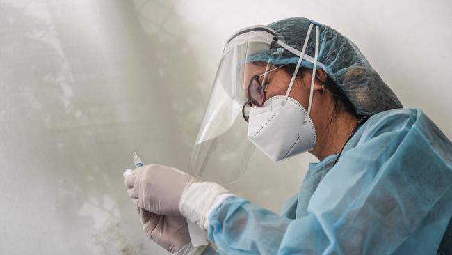 A health worker prepares a dose of a COVID-19 vaccine in Lima, Peru, on Thursday. Picture: AFP