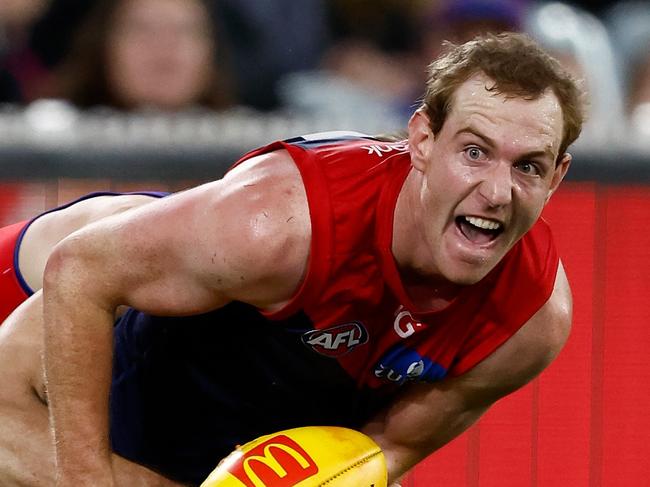 MELBOURNE, AUSTRALIA - APRIL 11: Harrison Petty of the Demons is tackled during the 2024 AFL Round 05 match between the Melbourne Demons and the Brisbane Lions at the Melbourne Cricket Ground on April 11, 2024 in Melbourne, Australia. (Photo by Michael Willson/AFL Photos via Getty Images)