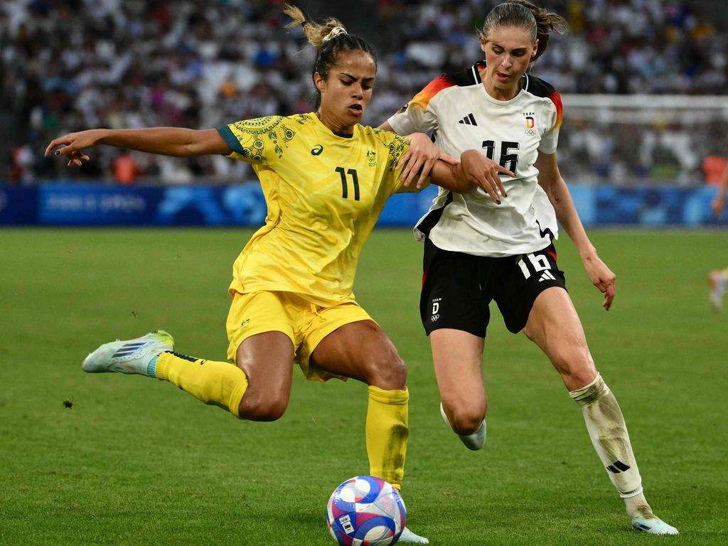 Australia's forward Mary Fowler is marked by Germany's Jule Brand. Picture: AFP