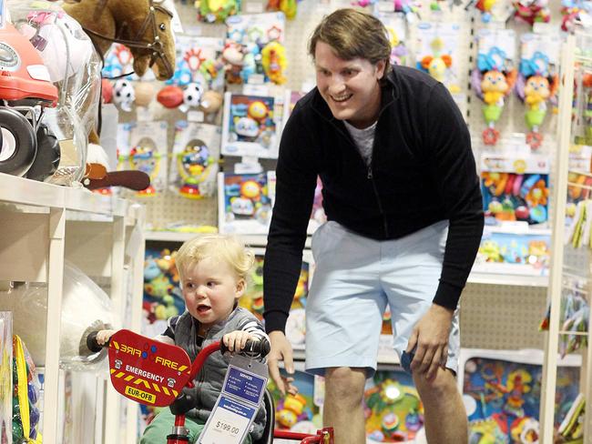 Business Bcm 7.8.15 - Toby Harpham of Toowoomba with his son Fred 2yrs shopping at Baby Bunting at James Street New Farm.Baby Bunting is expanding their number of stores in Queensland - pic Adam Smith