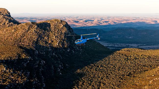 The surreal Flinders Ranges landscape is a dramatic sight made all the more impressive by a late-afternoon bird’s-eye view from a helicopter