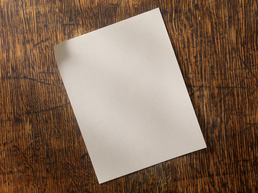 Blank Recycled Paper on an Old Wooden Desk -Photographed on Hasselblad H3D2-39mb Camera