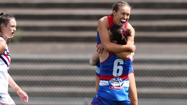 Hannah Munyard celebrates after kicking a goal for the Bulldogs. Picture: Michael Klein