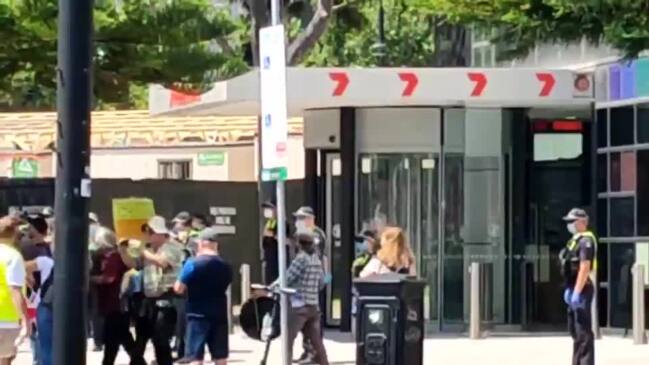 Anti-vaccine protesters gather outside the Melbourne TV building