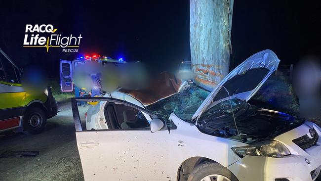 The crumpled wreck of a vehicle that crashed at Wolvi on Sunday night. Picture: RACQ LifeFlight