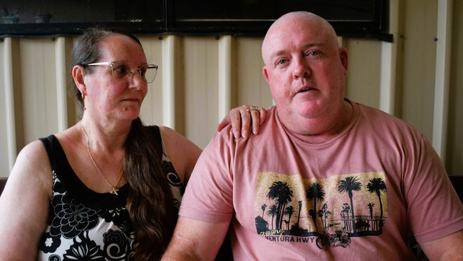 John “Benny” Benstead and wife Racheal at their home in Kirwan, Townsville. Mrs Benstead said “it kills me” to see her husband battling Reactive Airways Dysfunction Syndrome after he was allegedly covered in a load of fly ash in an alleged industrial accident driving a loader for Holcim in Bohle, Townsville in early 2023. Picture: Cameron Bates