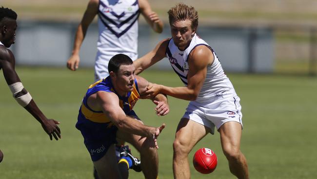 Jeremy McGovern tries to knock the ball away from Mitch Crowden.