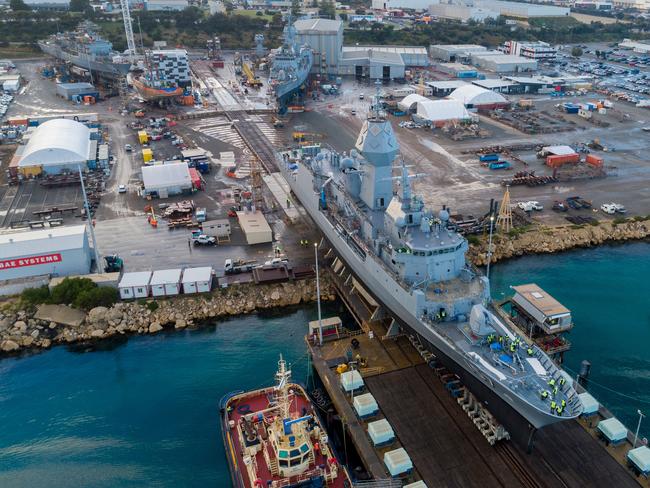 HMAS Perth is moved out of the dry dock at Australian Marine Complex at Henderson, WA after completing a major part of the Anzac Midlife Capability Assurance Program to upgrade radar capabilities, communications systems and crew habitable areas. *** Local Caption *** On 1 July 2021, after more than 1000 days out of water, the Royal Australian Navy Frigate HMAS Perth undocked to finalise her midlife capability assurance program upgrade at Henderson Dockyard, Western Australia. HMAS Perth (III) is the last of eight Anzac class frigates built by Tenix Defence Systems at Williamstown, Victoria for the Royal Australian Navy. HMAS Perth was commissioned in 26 August 2006. Perth is a long-range frigate capable of air defence, surface and undersea warfare, surveillance, reconnaissance and interdiction.