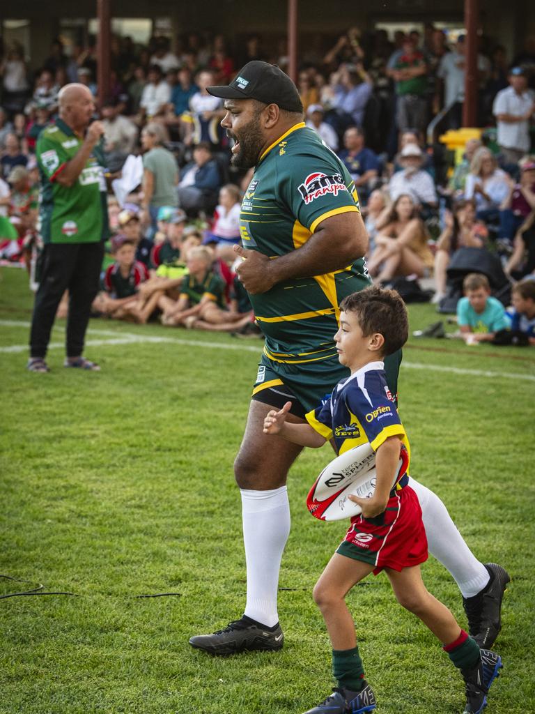 Sam Thaiday runs out with Danes junior Wylie Bunyab.