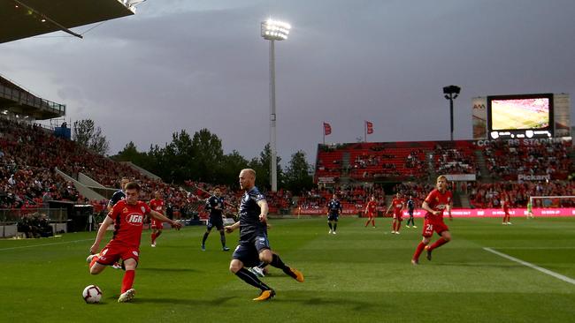 A solid crowd watches the season opener at Hindmarsh Stadium despite bad weather. Picture: James Elsby/Getty Images