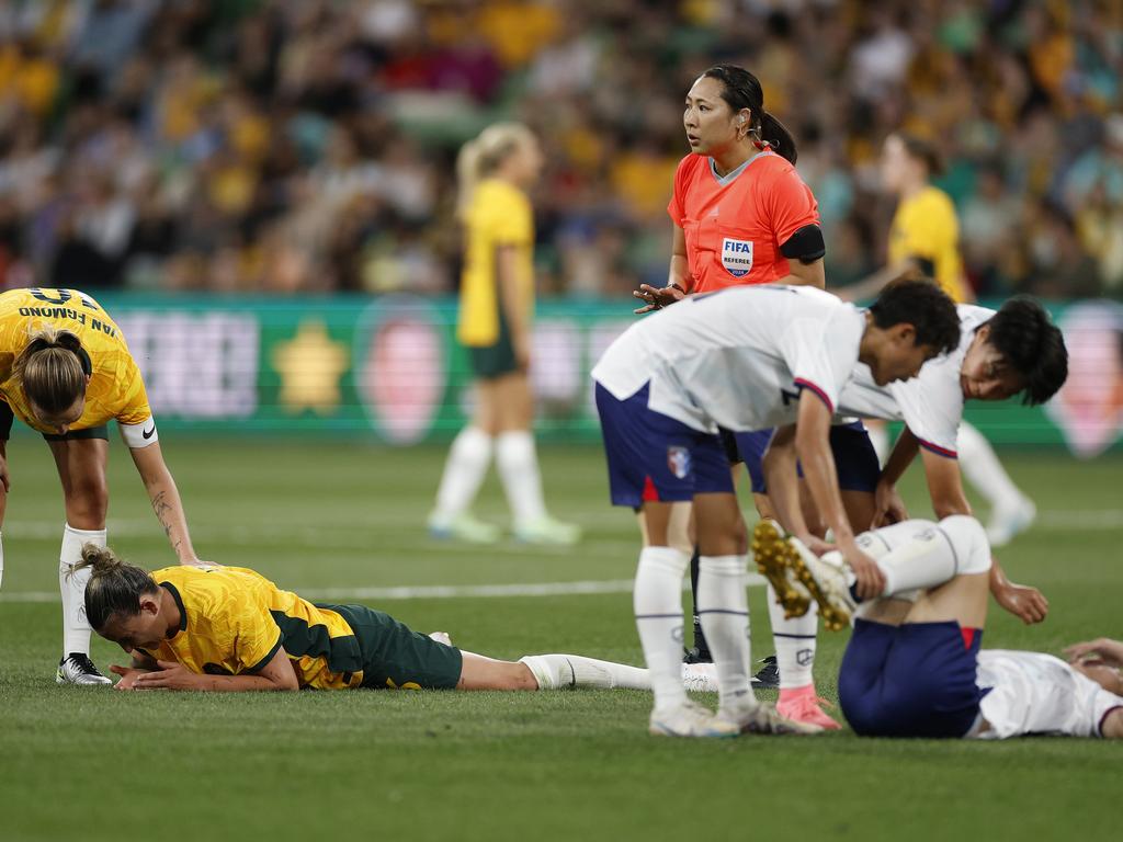 MELBOURNE, AUSTRALIA - DECEMBER 04: Chloe Logarzo of Australia and Chan Pi-Han of Chinese Taipei are attended to after a head clash during the International Friendly match between Australia Matildas and Chinese Taipei at AAMI Park on December 04, 2024 in Melbourne, Australia. (Photo by Daniel Pockett/Getty Images)