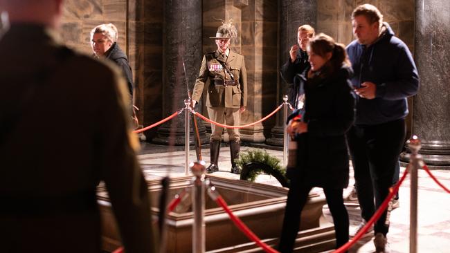 Members of the public place poppies inside the sanctuary at the Shrine of Remembrance. Picture: Asanka Ratnayake/Getty Images