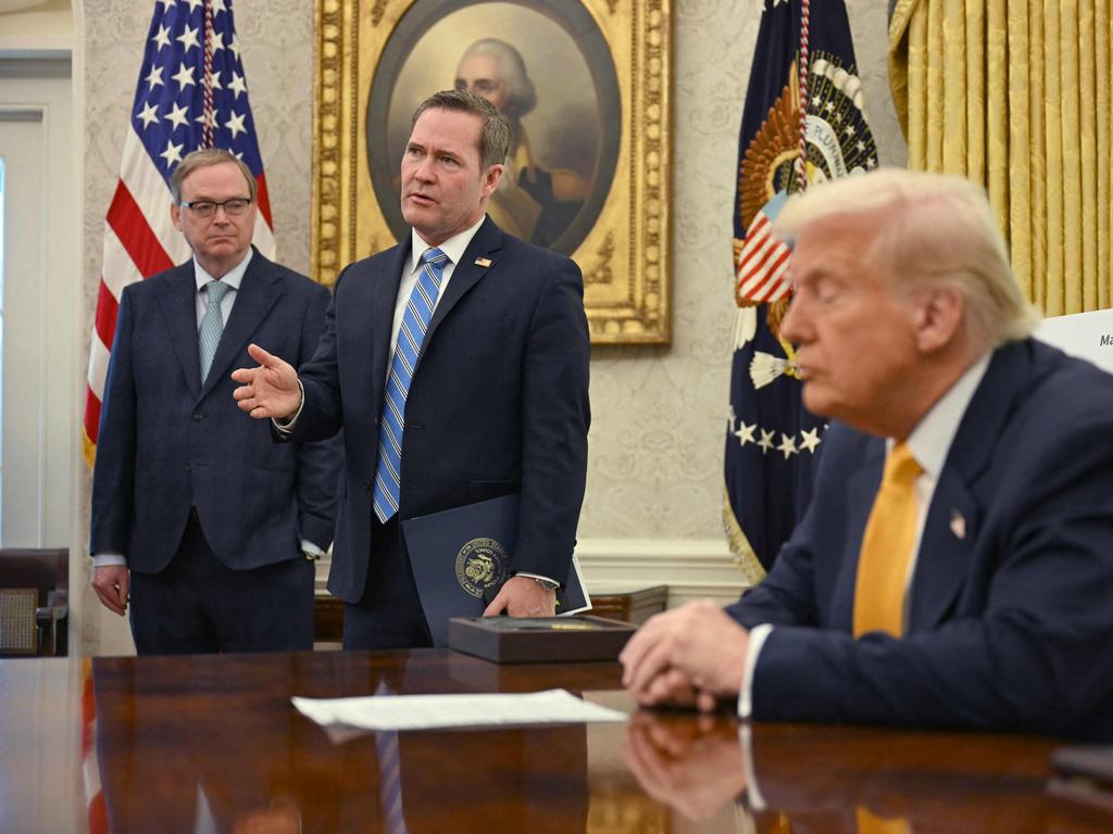 US President Donald Trump listens to National Security Adviser Mike Waltz as he speaks from the Oval Office of the White House for the latest tariffs announcement. Picture: AFP