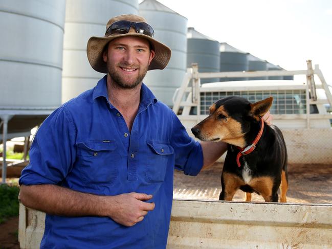 Farmer Dan Fox with his dog Batman on his farm in Marrar. Picture: Jonathan Ng