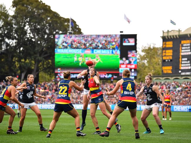 Jess Foley, centre, in a ruck contest against Carlton’s Alison Downie during the Crows whopping 45-point win in the 2019 AFLW grand final at Adelaide Oval on March 31. Picture: Daniel Kalisz/Getty Images