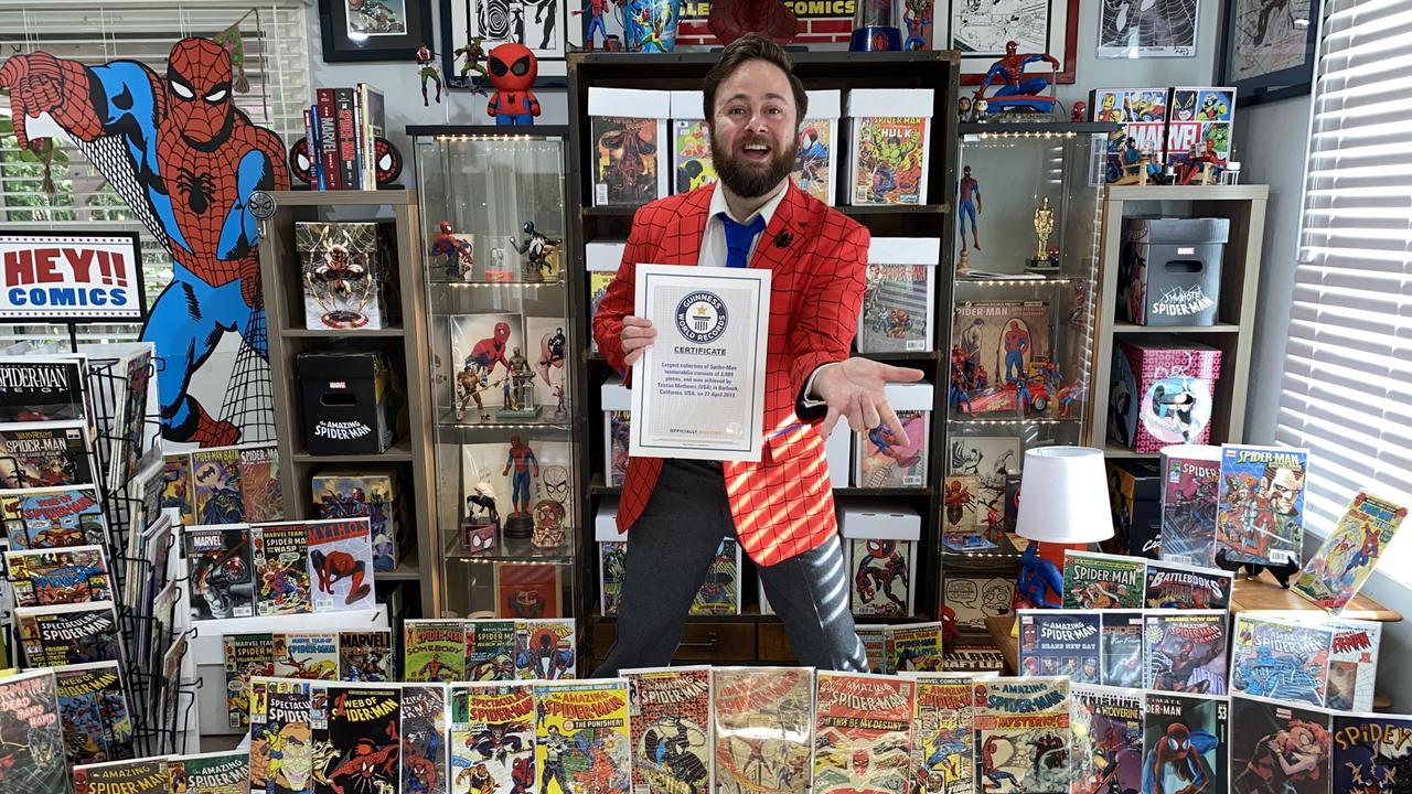 Tristan Mathews with some of this Spider-Man memorabilia.