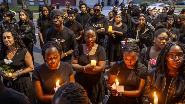 Mourners hold a Candlelight vigil is for stabbing murder victim Nathan Mwanza in Wyndham Vale. Picture: Jake Nowakowski