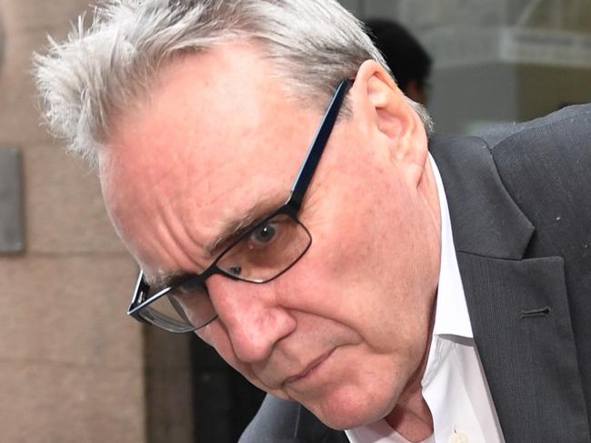 ATO deputy commissioner Michael Cranston, the father of Adam Cranston, is seen near the Central Local Court in Sydney on Thursday, May 18, 2017. The AFP have cracked a major conspiracy to defraud taxpayers of at least $165 million by running a payroll scam out of Sydney. Nine people have been charged, including Adam Cranston. (AAP Image/Paul Miller) NO ARCHIVING