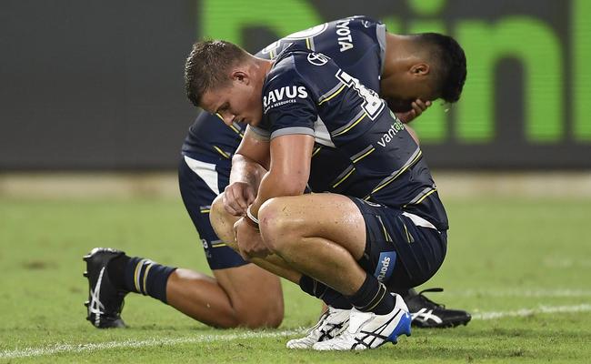 Mitch Dunn and Murray Taulagi of the Cowboys dejected after the loss. (Photo by Ian Hitchcock/Getty Images)