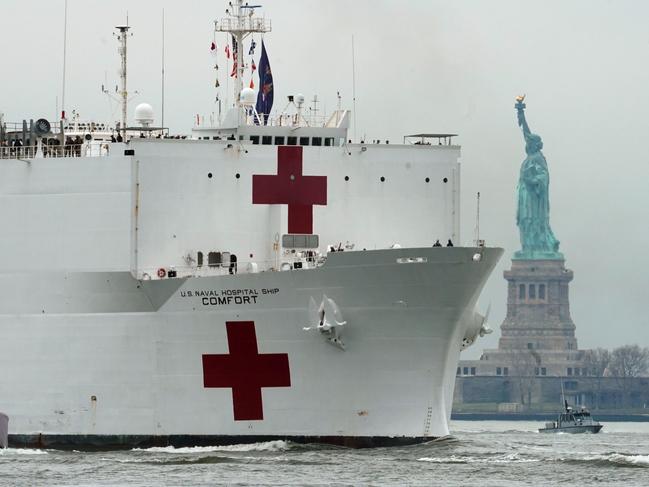 The USNS Comfort medical ship moves up the Hudson River past the Statue of Liberty as it arrives in New York. Picture: AFP